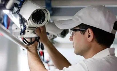 A professional technician performs an expert installation of ...